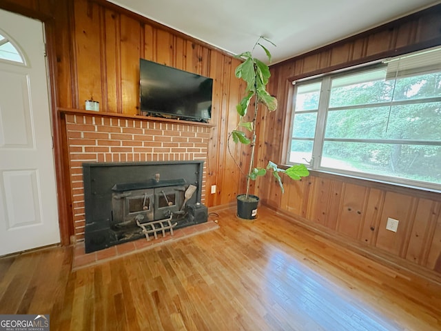 861 Ga Highway 87 N, Cochran, GA 31014 - living area with wooden walls, wood finished floors, and a fireplace