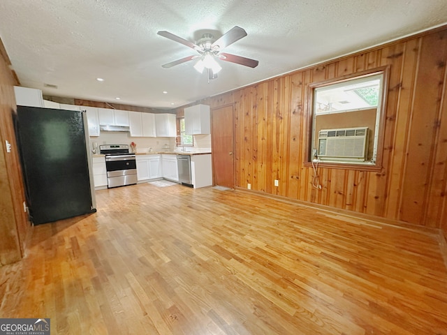 861 Ga Highway 87 N, Cochran, GA 31014 - kitchen featuring white cabinetry, light wood finished floors, light countertops, and stainless steel appliances