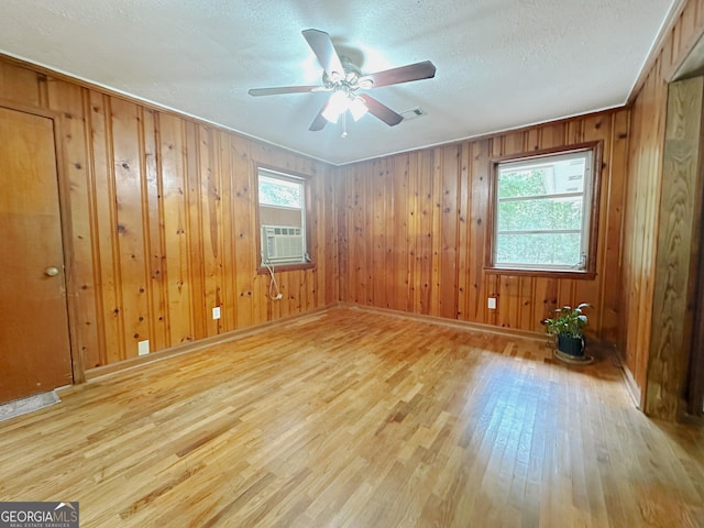 861 Ga Highway 87 N, Cochran, GA 31014 - spare room with a ceiling fan, a textured ceiling, cooling unit, visible vents, and wood finished floors