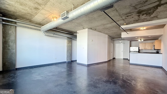 interior space with a sink and baseboards