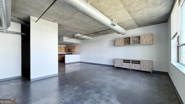 interior space with baseboards and radiator heating unit