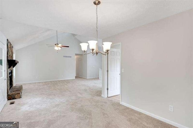 unfurnished living room featuring a fireplace with raised hearth, baseboards, visible vents, ceiling fan with notable chandelier, and light carpet