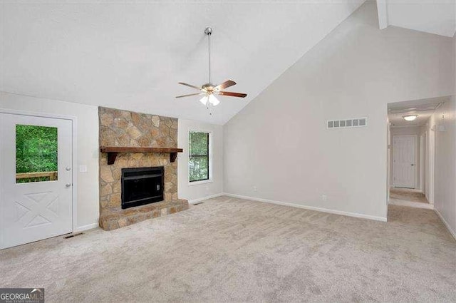 unfurnished living room featuring carpet, high vaulted ceiling, visible vents, a ceiling fan, and baseboards