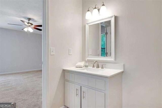bathroom with vanity and a ceiling fan