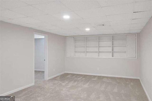 finished below grade area with baseboards, recessed lighting, and carpet floors