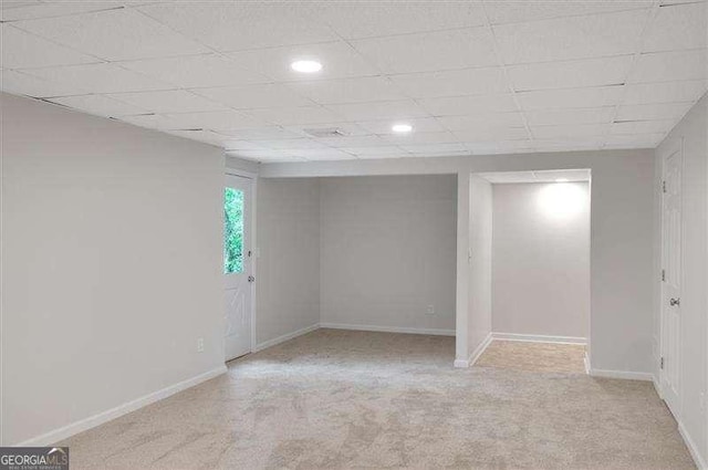 below grade area featuring carpet flooring, baseboards, and recessed lighting