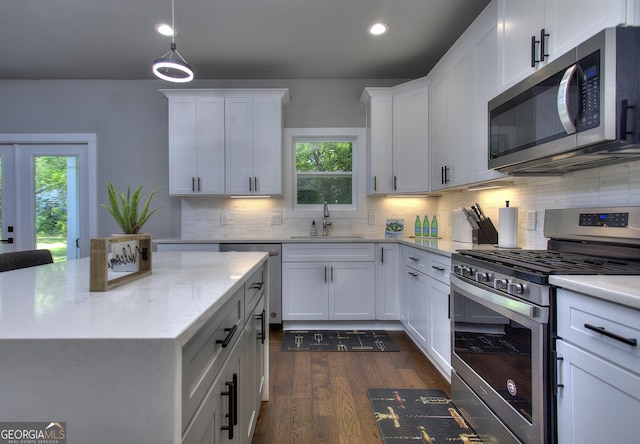 419 Mcinnes Cir SE, Marietta, GA 30060 - kitchen with stainless steel appliances, a sink, recessed lighting, healthy amount of natural light, and decorative backsplash