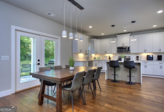 419 Mcinnes Cir SE, Marietta, GA 30060 - dining area with dark wood-style flooring, french doors, and recessed lighting