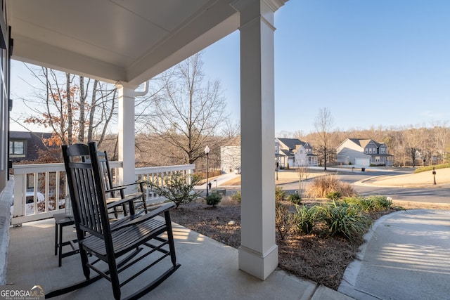 view of patio / terrace featuring a porch and a residential view