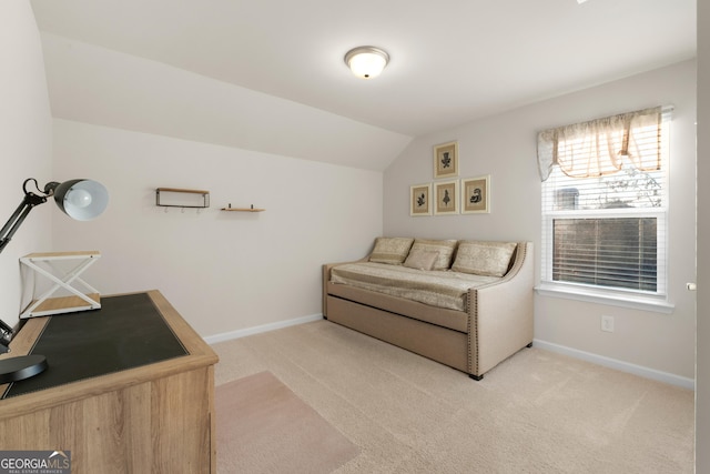 bedroom featuring baseboards, carpet flooring, and lofted ceiling