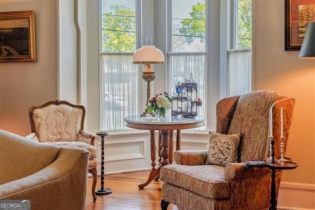 sitting room featuring wood finished floors