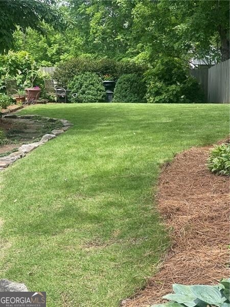 view of yard with fence