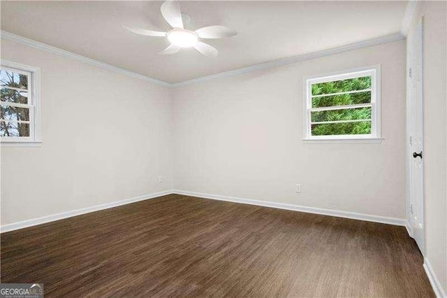 empty room featuring dark wood-style flooring, baseboards, a ceiling fan, and a healthy amount of sunlight