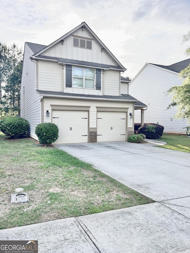 view of front of house with a garage, board and batten siding, driveway, and a front yard