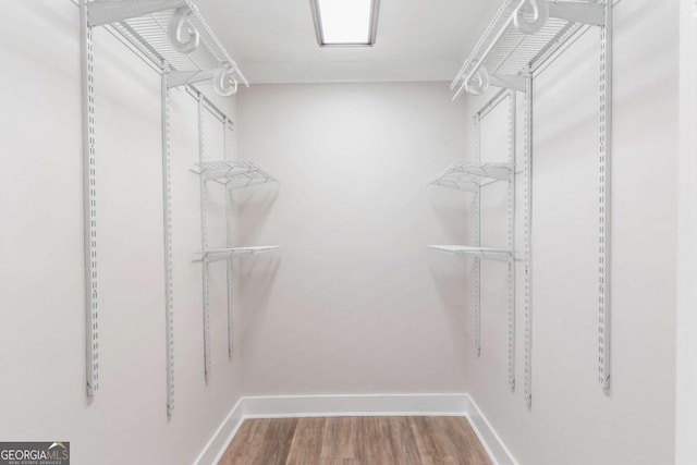 2260 Old Spring Rd SE, Smyrna, GA 30080 - walk in closet featuring wood finished floors