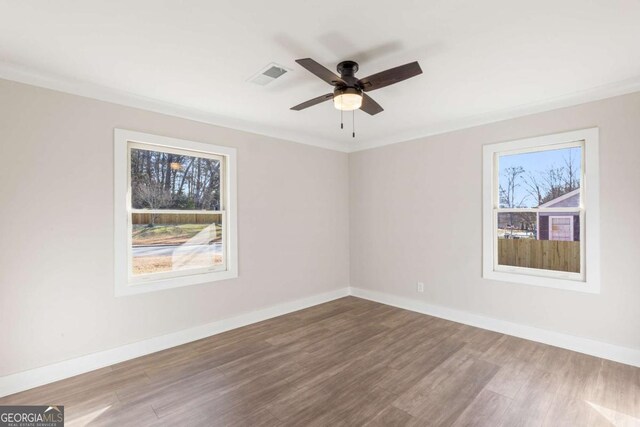 2260 Old Spring Rd SE, Smyrna, GA 30080 - spare room with wood finished floors and ceiling fan