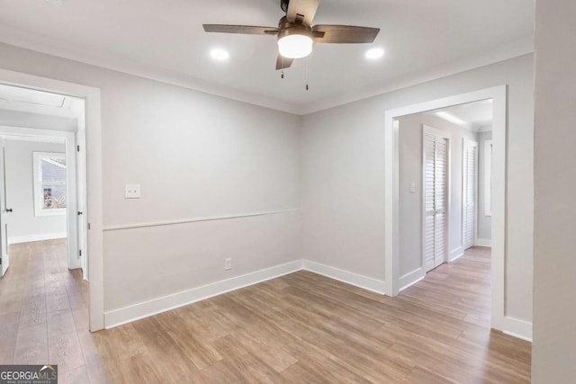 2260 Old Spring Rd SE, Smyrna, GA 30080 - spare room with ceiling fan, light wood finished floors, ornamental molding, recessed lighting, and attic access