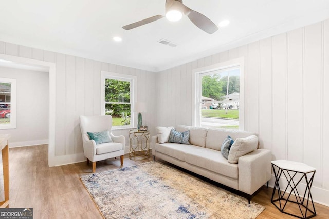 2260 Old Spring Rd SE, Smyrna, GA 30080 - living area featuring healthy amount of natural light, ceiling fan, and wood finished floors