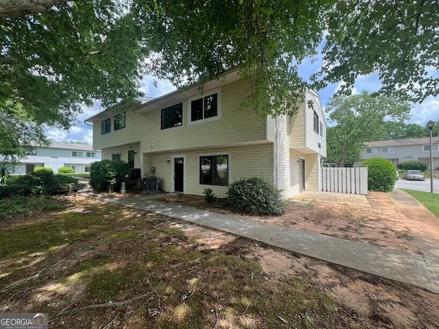 1466 Pine Log Rd NE Unit A, Conyers, GA 30012 - split foyer home featuring central air condition unit, a garage, and driveway