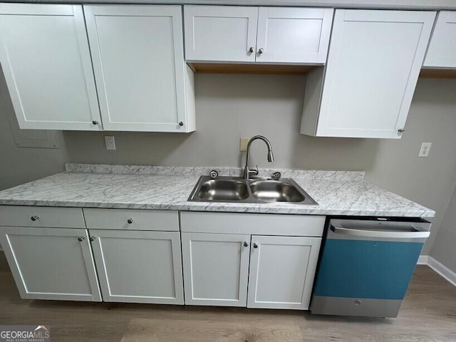 1466 Pine Log Rd NE Unit A, Conyers, GA 30012 - kitchen featuring baseboards, a sink, white cabinetry, dishwashing machine, and wood finished floors
