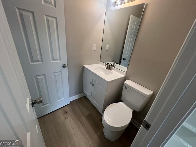 1466 Pine Log Rd NE Unit A, Conyers, GA 30012 - half bath featuring toilet, wood finished floors, and vanity