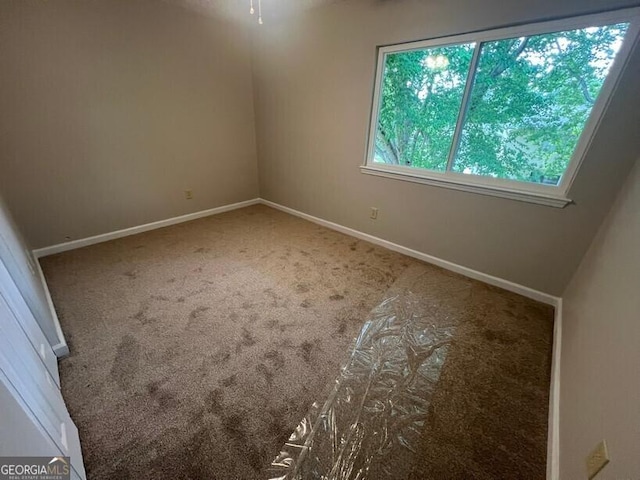 1466 Pine Log Rd NE Unit A, Conyers, GA 30012 - unfurnished room with carpet and baseboards