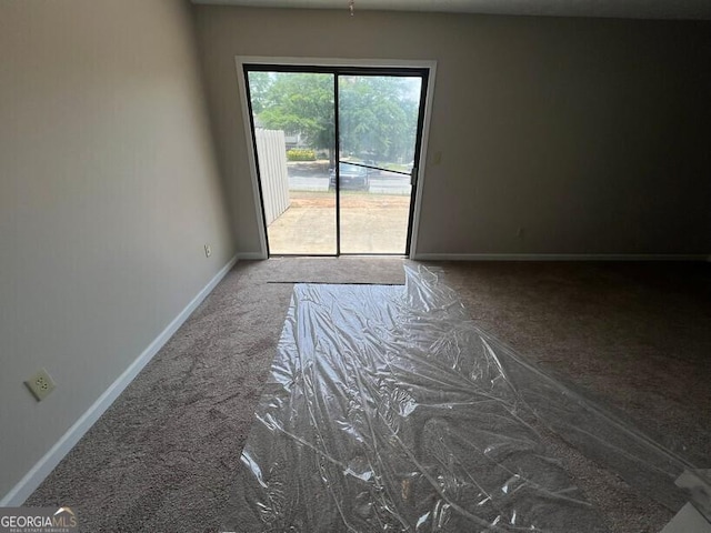 1466 Pine Log Rd NE Unit A, Conyers, GA 30012 - carpeted empty room with baseboards