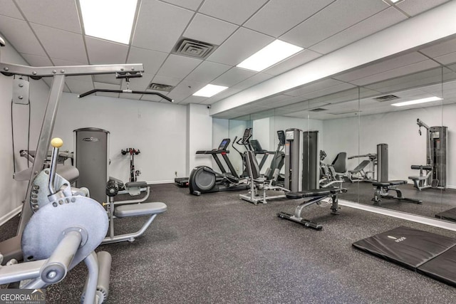 275 13th St NE Unit 605, Atlanta, GA 30309 - exercise room featuring a paneled ceiling and baseboards