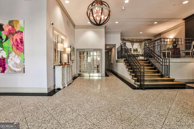 275 13th St NE Unit 605, Atlanta, GA 30309 - entrance foyer with granite floors, crown molding, baseboards, stairs, and recessed lighting