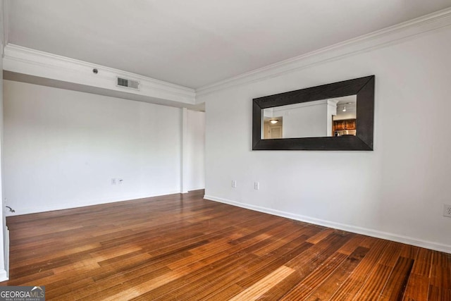 275 13th St NE Unit 605, Atlanta, GA 30309 - spare room featuring crown molding, hardwood / wood-style flooring, and baseboards