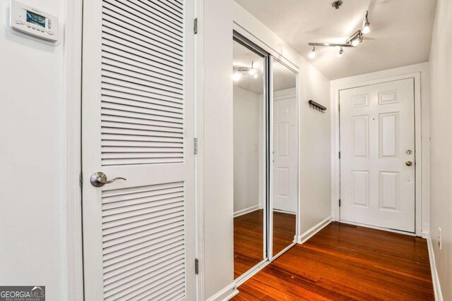 275 13th St NE Unit 605, Atlanta, GA 30309 - hallway with dark wood-style flooring and baseboards