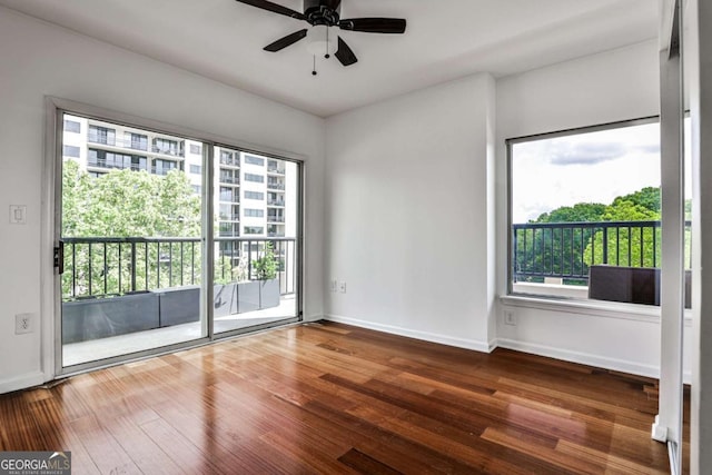 275 13th St NE Unit 605, Atlanta, GA 30309 - unfurnished room featuring wood finished floors, a ceiling fan, and baseboards