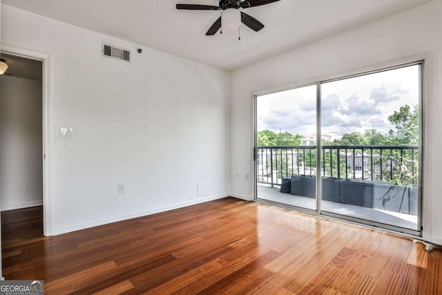 275 13th St NE Unit 605, Atlanta, GA 30309 - unfurnished room featuring healthy amount of natural light, wood finished floors, a ceiling fan, and baseboards