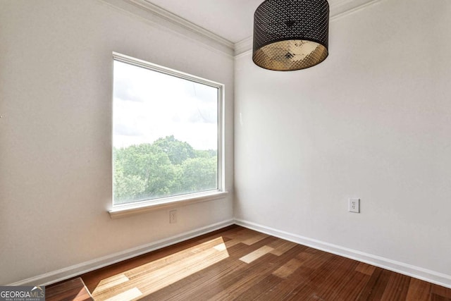 275 13th St NE Unit 605, Atlanta, GA 30309 - empty room with baseboards, crown molding, and wood finished floors