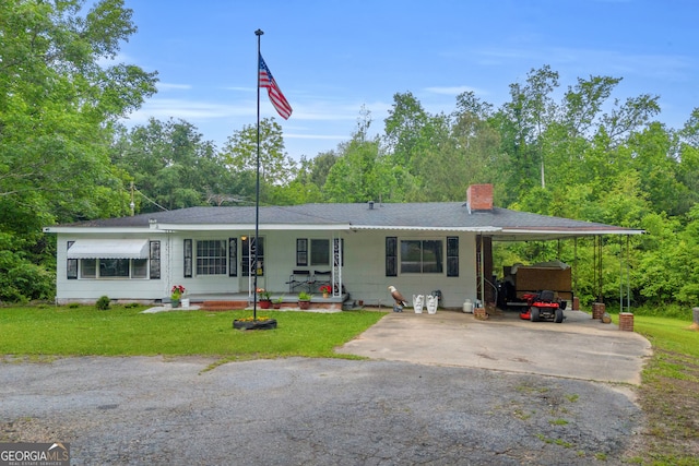 627 N Hulin Ave, Tignall, GA 30668 - ranch-style home with driveway, an attached carport, a chimney, and a front yard