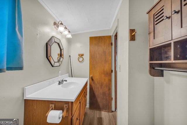 627 N Hulin Ave, Tignall, GA 30668 - bathroom with vanity, crown molding, and wood finished floors