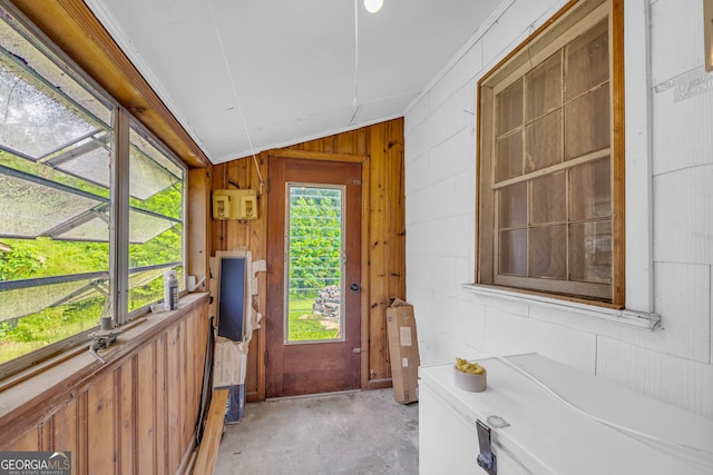 627 N Hulin Ave, Tignall, GA 30668 - entryway featuring vaulted ceiling, unfinished concrete floors, and wooden walls
