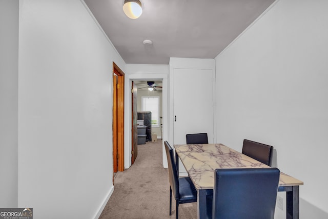 627 N Hulin Ave, Tignall, GA 30668 - dining space featuring carpet flooring, crown molding, and ceiling fan