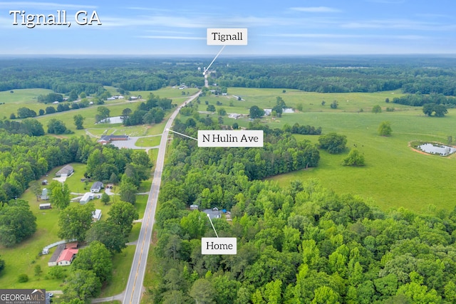 627 N Hulin Ave, Tignall, GA 30668 - drone / aerial view featuring a wooded view