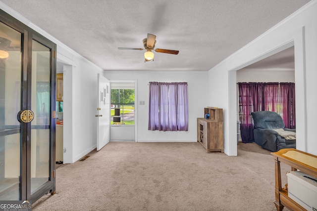 627 N Hulin Ave, Tignall, GA 30668 - interior space featuring ornamental molding, a textured ceiling, baseboards, and ceiling fan