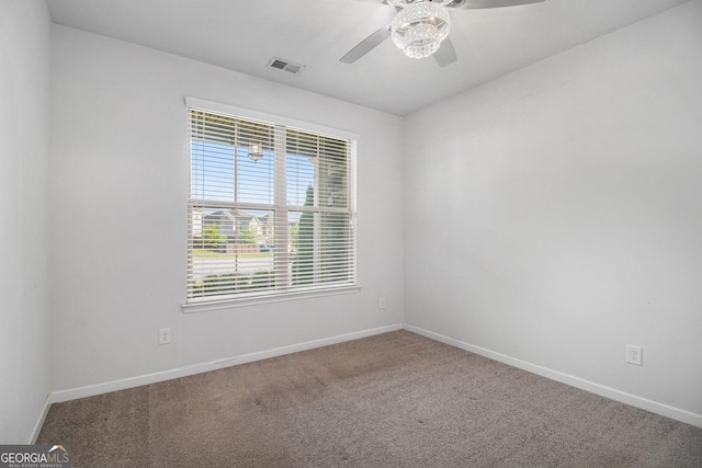 2113 Dodson Woods Dr, Fairburn, GA 30213 - spare room with carpet, visible vents, baseboards, and ceiling fan