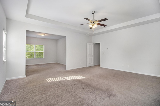 2113 Dodson Woods Dr, Fairburn, GA 30213 - carpeted spare room with a ceiling fan, baseboards, and a raised ceiling