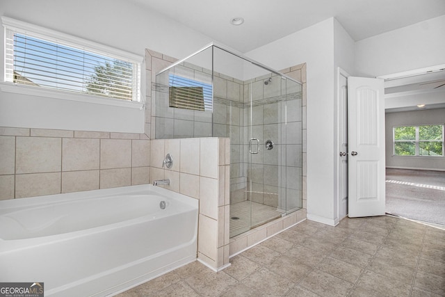 2113 Dodson Woods Dr, Fairburn, GA 30213 - full bathroom with a bath, baseboards, and a stall shower