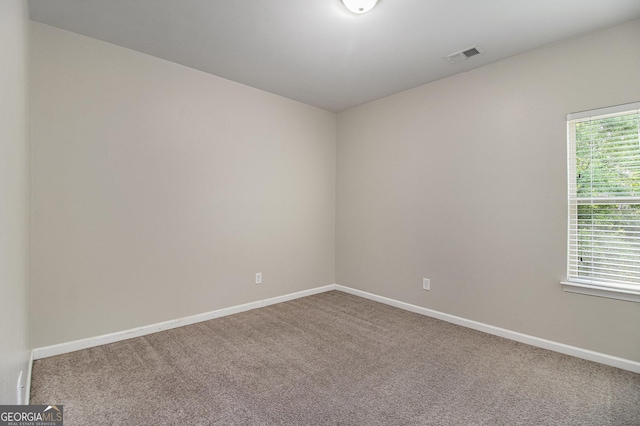 2113 Dodson Woods Dr, Fairburn, GA 30213 - carpeted empty room with baseboards and visible vents