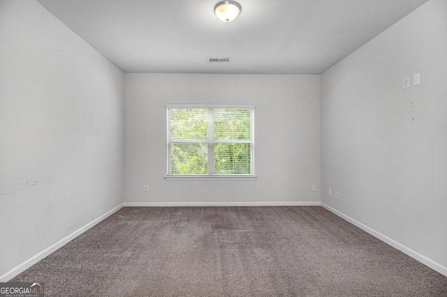 2113 Dodson Woods Dr, Fairburn, GA 30213 - carpeted spare room featuring visible vents and baseboards