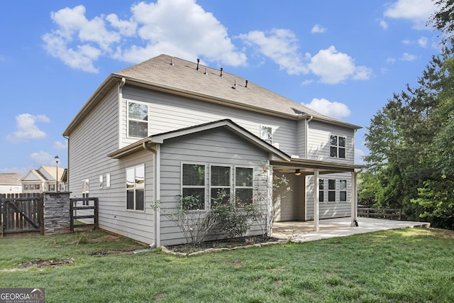 2113 Dodson Woods Dr, Fairburn, GA 30213 - back of house featuring a patio, a gate, fence, ceiling fan, and a yard