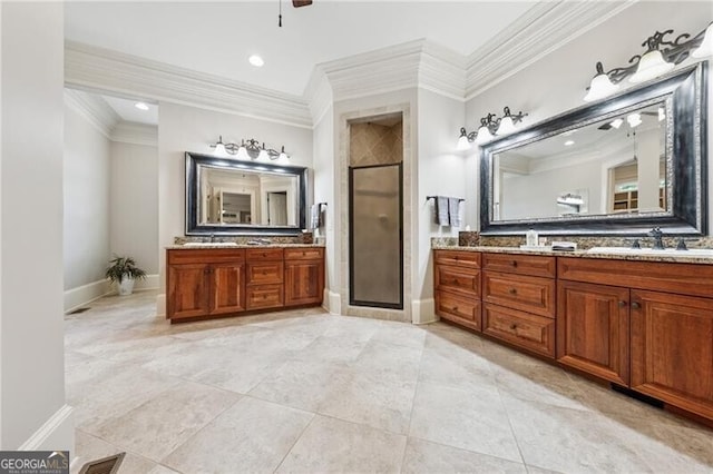 full bath with tile patterned floors, crown molding, ceiling fan, a shower stall, and baseboards