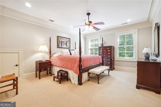 bedroom with baseboards, crown molding, visible vents, and light colored carpet
