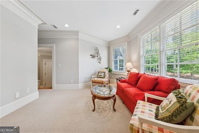 sitting room featuring baseboards, visible vents, crown molding, and carpet
