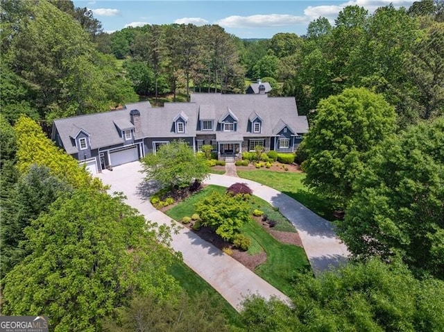 drone / aerial view with a view of trees